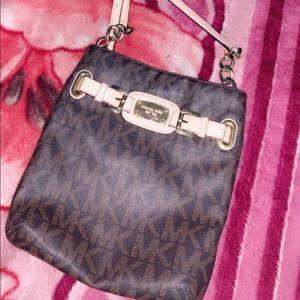 A Micheal Kors crossbody purse.